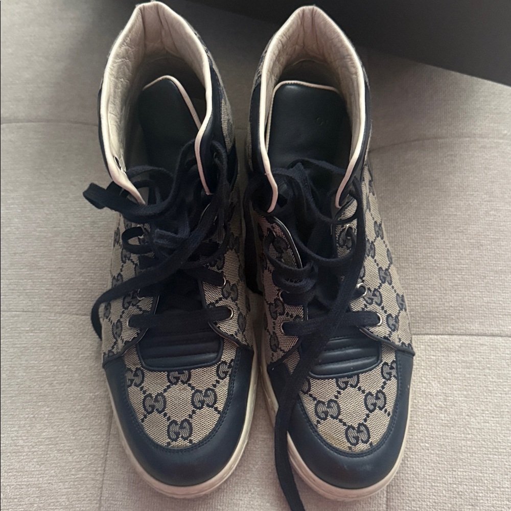 Gucci Black and Cream High-Top Sneakers
Fits like a men’s 8-8.5